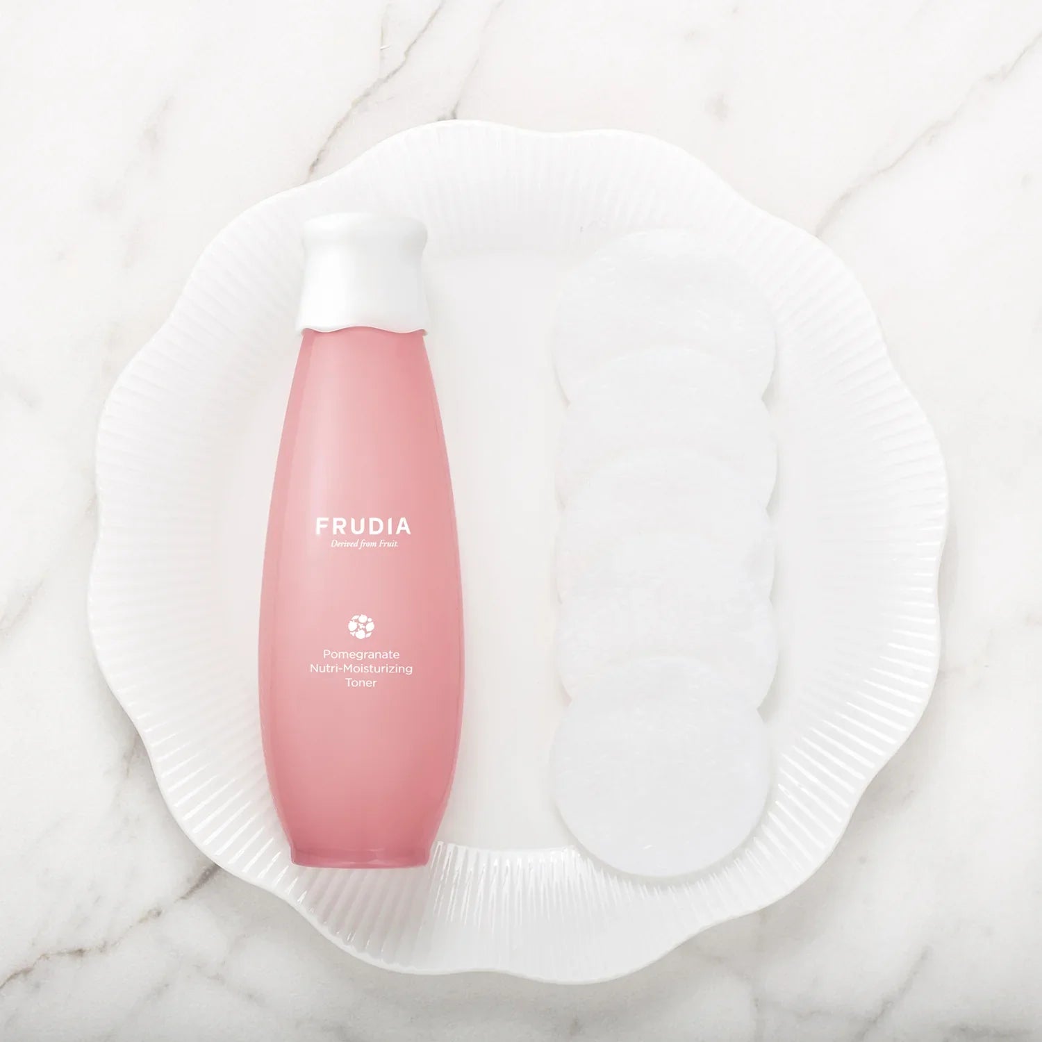 Pink bottle of Frudia Pomegranate Nutri-Moisturizing Toner for vegan firming toner 