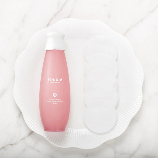 Pink bottle of Frudia Pomegranate Nutri-Moisturizing Toner for vegan firming toner 