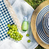 Frudia Green Grape Pore Control Serum bottle, vegan Korean skincare for pores on picnic blanket