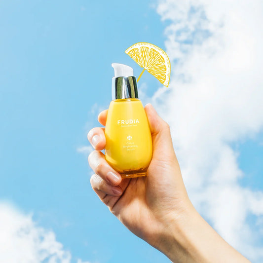 Frudia Citrus Brightening Serum Skincare with Vitamin C on blue background