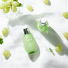 Frudia Green Grape Pore Control Serum bottle, vegan Korean skincare for pores on white background with grapes 