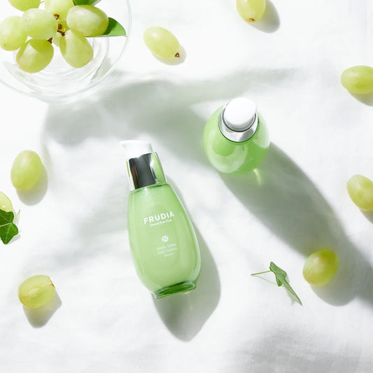 Frudia Green Grape Pore Control Serum bottle, vegan Korean skincare for pores on white background with grapes 