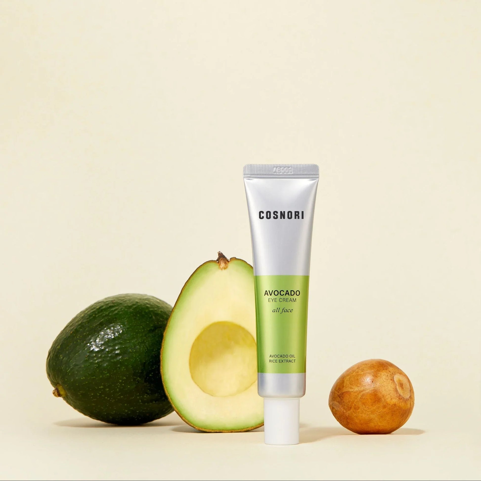 COSNORI Avocado Eye Cream tube with avocado in the background