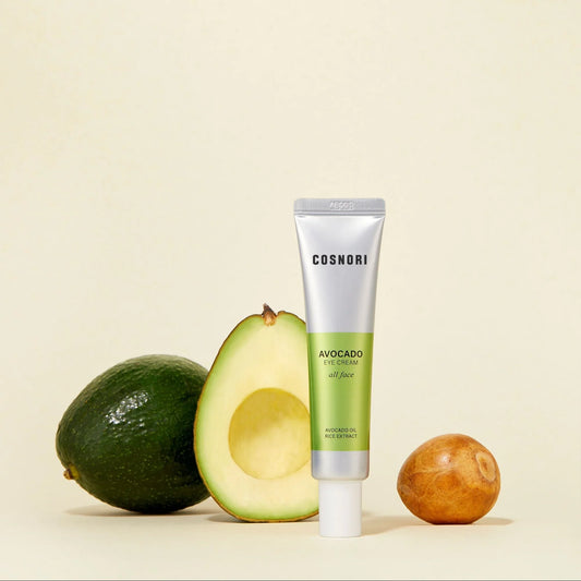 COSNORI Avocado Eye Cream tube with avocado in the background