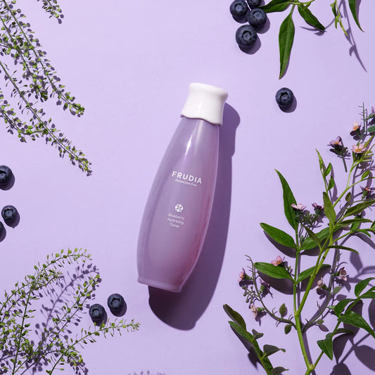 Frudia Blueberry Hydrating Toner vegan Korean skincare bottle on purple background