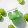 Frudia Green Grape Pore Control Cream vegan Korean skincare jar with matte white lid on white background with green grapes