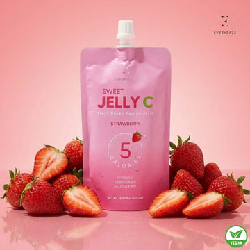 Strawberry Sweet Jelly C with Vitamin C, zero sugar, gluten-free, vegan, 5 calories, surrounded by fresh strawberries on pink background