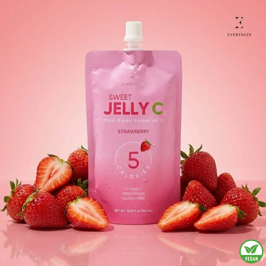 Strawberry Sweet Jelly C with Vitamin C, zero sugar, gluten-free, vegan, 5 calories, surrounded by fresh strawberries on pink background