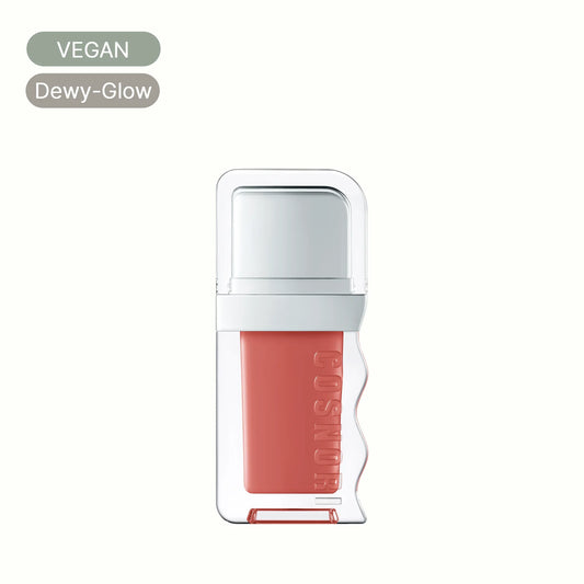 Vegan dewy-glow lip tint in clear square bottle with peach pink color