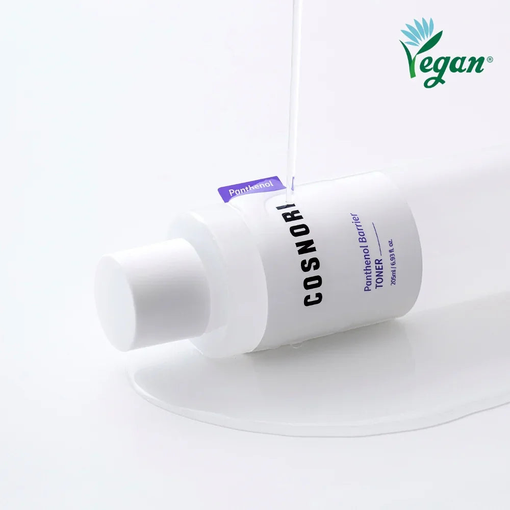 COSNORI Panthenol Barrier Toner with bottle lying on white surface
