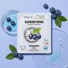 Blueberry Repair eye pads Korean skincare sheet mask with fresh blueberries and hydrogel patches on light blue background.